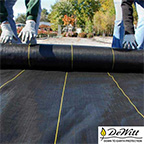 landscape fabric being installed